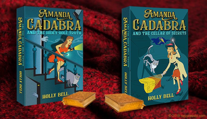 Amanda Cadabra Book 1 and 2 with a little gold book in front of each, on a cozy dark red woolen background