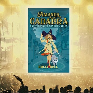 Audience, stage with cover of Amanda Cadbar and The Rise of Sunken Madley. Amanda with wand in hand, pointing at the ground, stands with her cat beside her in a ring of salt. It is a stormy afternoon, she holds her witch's hat with her left hand. The village is in the background and at either side