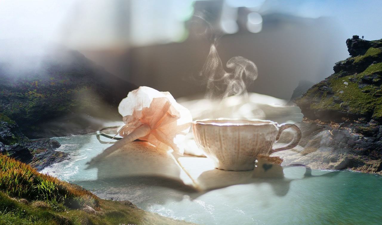 Cornish connect - to a coz mystery?flower and steaming cup on book fading into Cornish scenery