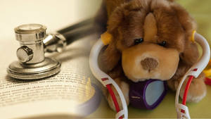 Medical atters in cozy mysteryCuddly toy dog wearing toy stethoscope beside book with real stethoscope on it