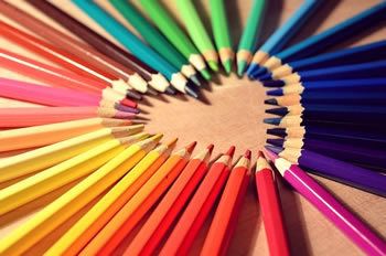 Coloured pencils with tips forming a heart shape