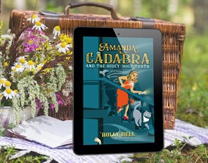 ebook in ereader Amanda Cadabra and The Hidey-Hole Truth, leaning on a picnic basket with wild flowers on the left