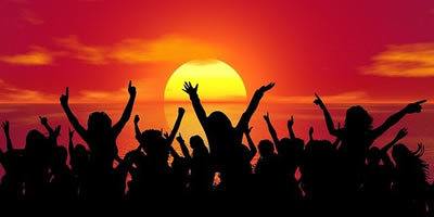 Celebration, silhouette of people dancing against sunset/sunrise