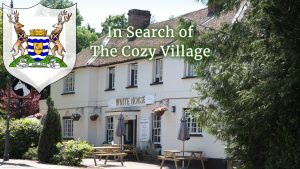 White Horse Pub in Hertingfordbury with Hertfordshire crest and text: In Search of The Cozy Village