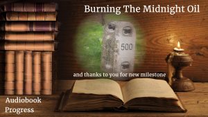 Open book on desk by candleight with cameo milestone. Text: Burning The Midnight Oil, Audiobook Progress, and thanks t you for a new milestone