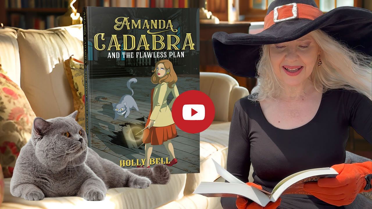 Link to chapter 1 of Amanda Cadabra and The Flawless Plan read aloud by Holly Bell in witch hat reading from Amanda Cadabra book while grey British Blue cat looks up at her grumpily from the sofa in a sunny room