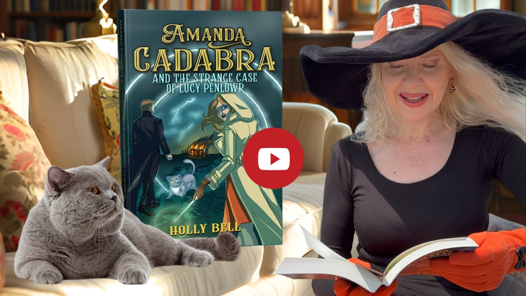 Click to go to video of Holly Bell reading Chapter 1 of Amanda Cadabra and The Strange Case of Lucy Penlowr. Image of Holly Bell in witch hat reading from Amanda Cadabra book while grey British Blue cat looks up at her grumpily from the sofa in a sunny room