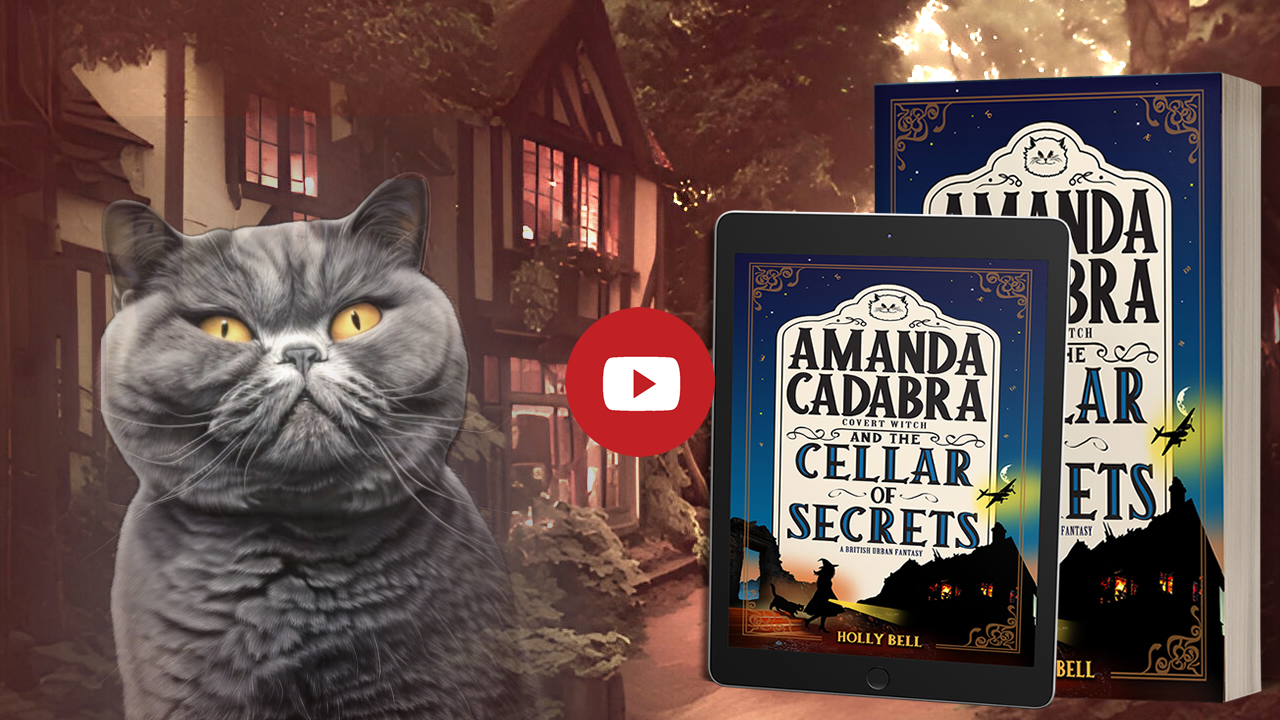 Link to chapter 1 of Amanda Cadabra and The Cellar of Secrets read aloud by Holly Bell in witch hat reading from Amanda Cadabra book while grey British Blue cat looks up at her grumpily from the sofa in a sunny room