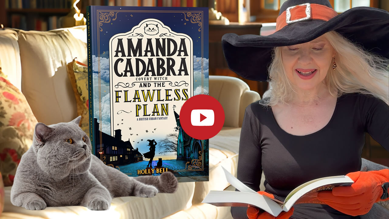 Link to chapter 1 of Amanda Cadabra and The Flawless Plan read aloud by Holly Bell in witch hat reading from Amanda Cadabra book while grey British Blue cat looks up at her grumpily from the sofa in a sunny room