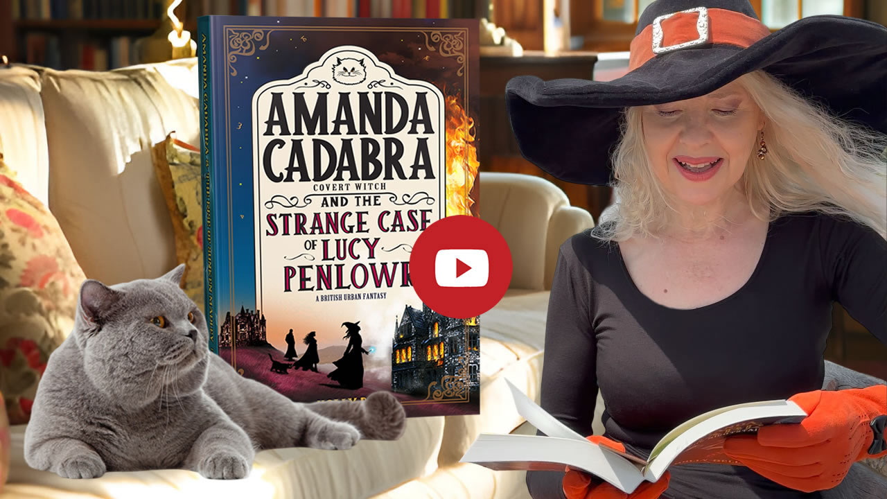 Click to go to video of Holly Bell reading Chapter 1 of Amanda Cadabra and The Strange Case of Lucy Penlowr. Image of Holly Bell in witch hat reading from Amanda Cadabra book while grey British Blue cat looks up at her grumpily from the sofa in a sunny room