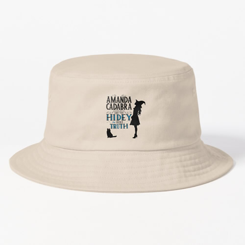 Cream bucket hat with . On the front: Amanda Cadabra and The Hidey-Hole Truth text with silhouette of Amanda in witch hat  looking up, on the right of the text, and silhouette of Tempest, her cat and familiar opposite her feet below and on the left of the text 